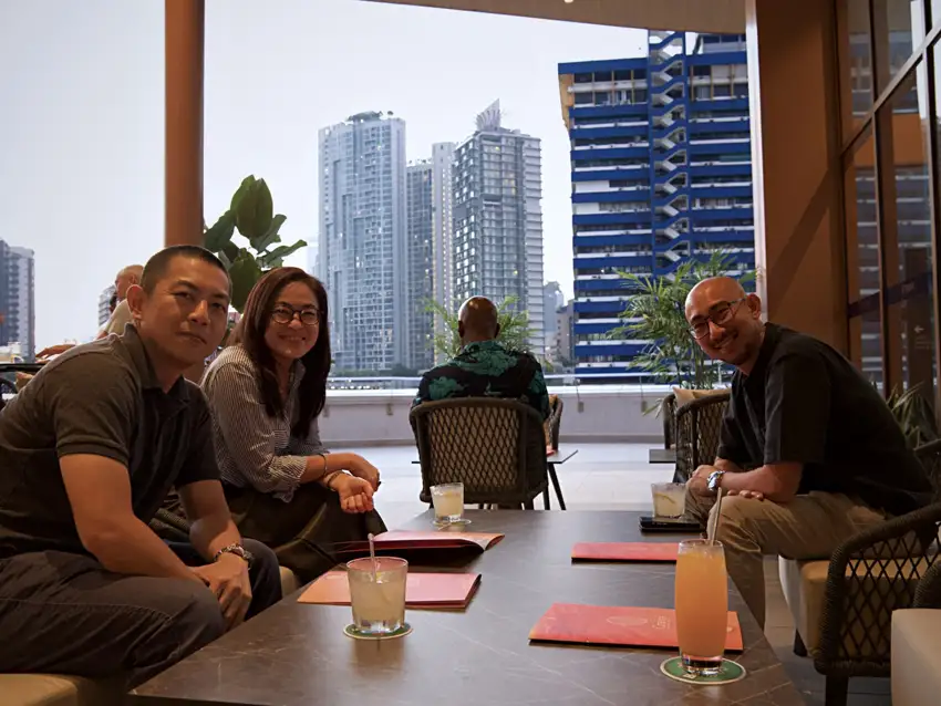 Guests around a table at Crafty’s in daylight