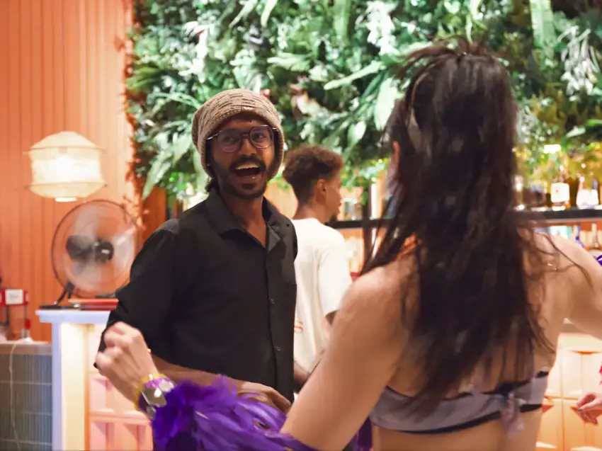 A smiling member of the Crafty’s team chatting with a guest
